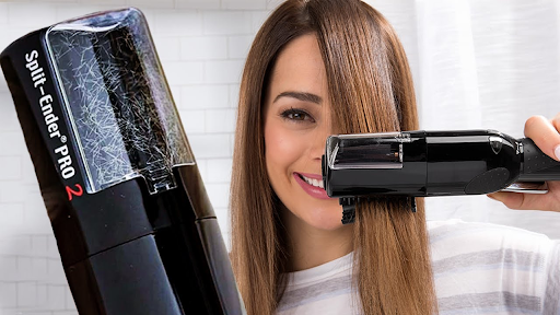 User holding the Split Ender Pro split end machine, demonstrating easy home trimming without losing hair length.
