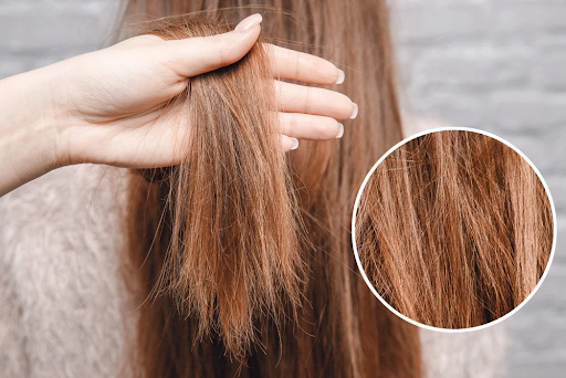 Woman examining split ends before event—split ends treatment starts with fast, targeted care for damaged ends.