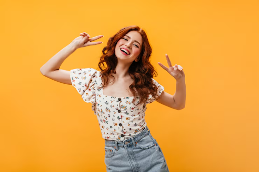 Happy woman with healthy, split ends-free hair celebrating her results from the best split end treatment.